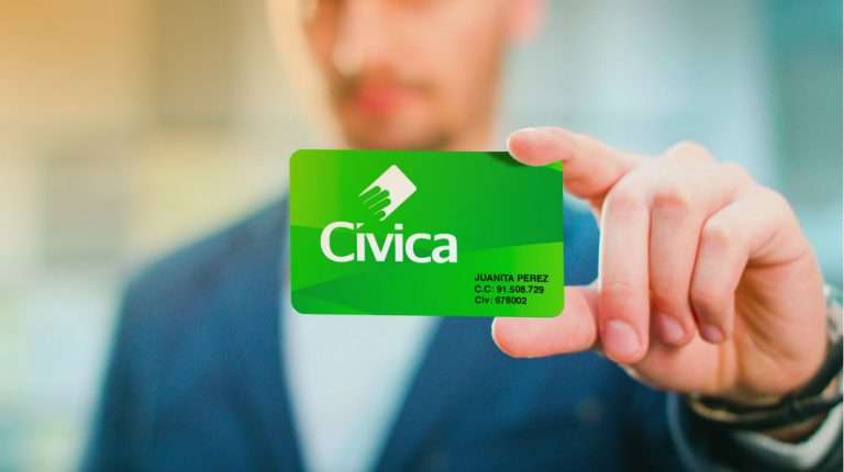 A handsome businessman holding a Civica card, the card that gives access to the public transportation in Medellin Colombia